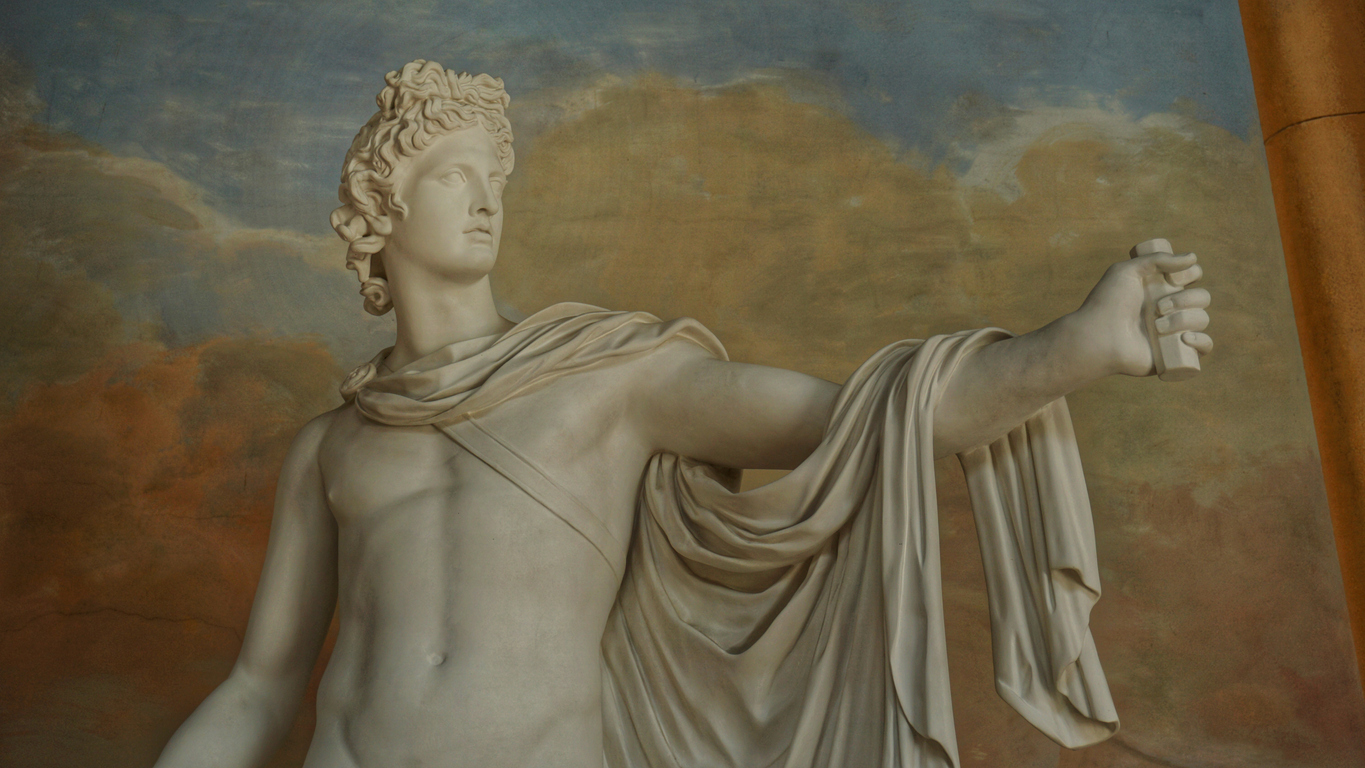 Classical white marble sculpture of mythological figure with detailed drapery, showcasing traditional marble bust sculpture from ancient Greece and Rome.