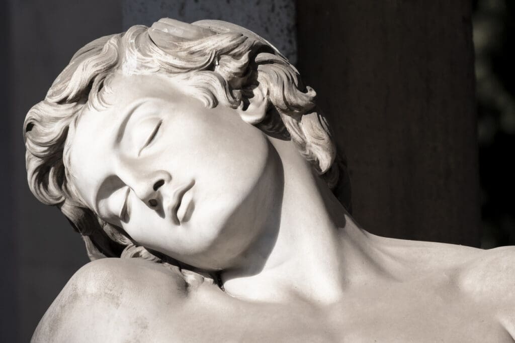 Modern white marble bust sculpture with serene expression, blending classical carving technique with contemporary artistic interpretation.